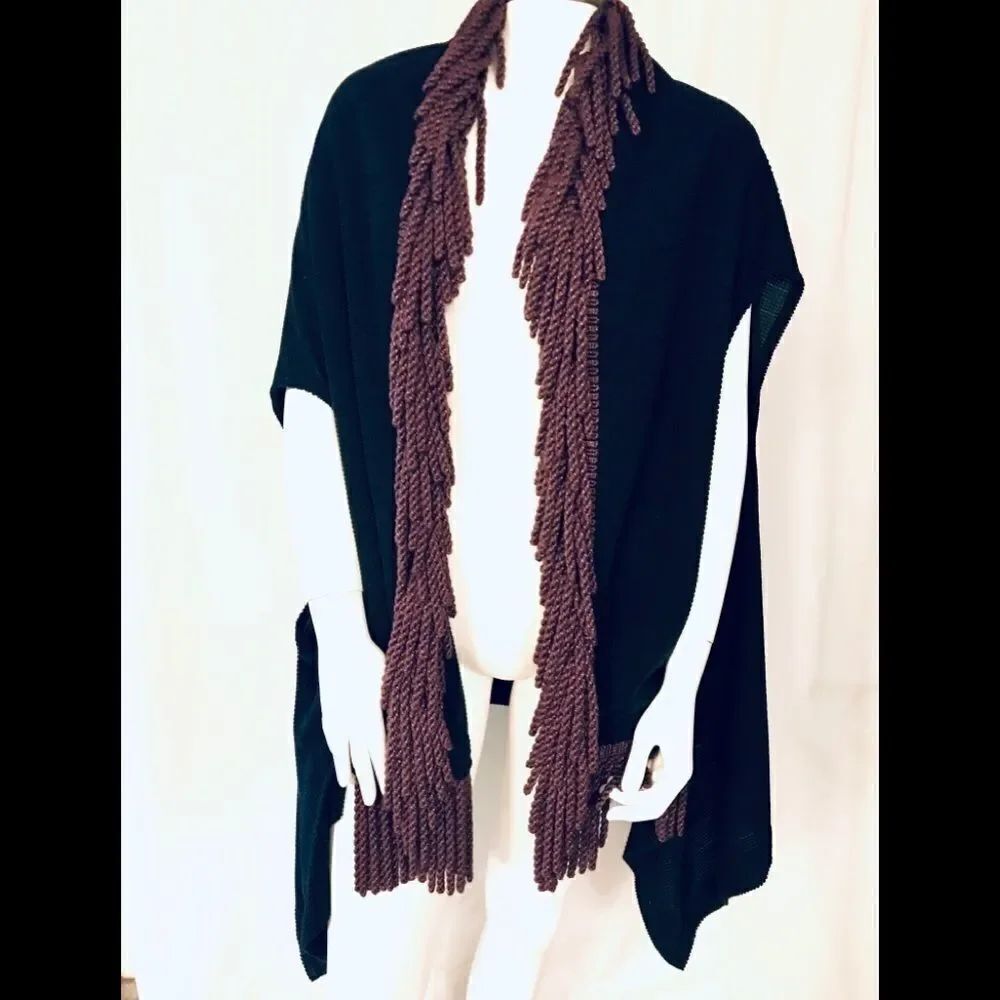 Black waffle pattern cape, burgundy fringe trim